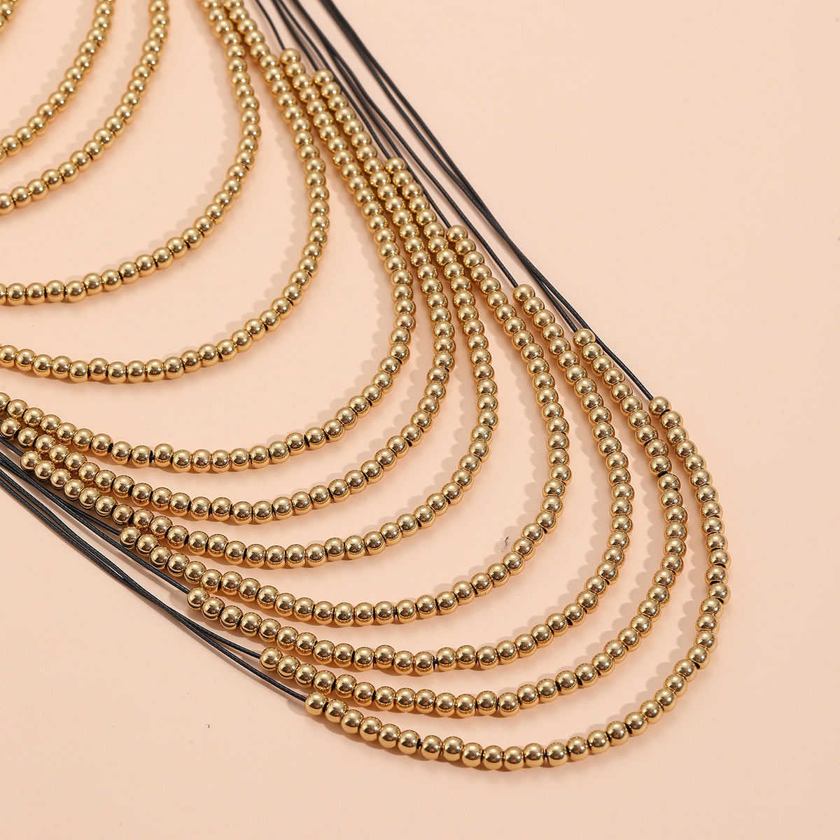 Multi layered gold bead necklace